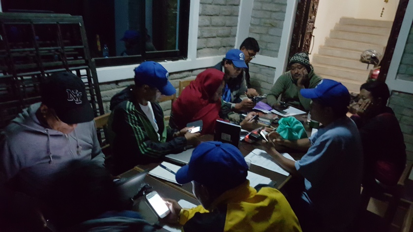 Discussing community feedbacks gathered using Poimapper (an app for data collection) with the Dolakha Team.